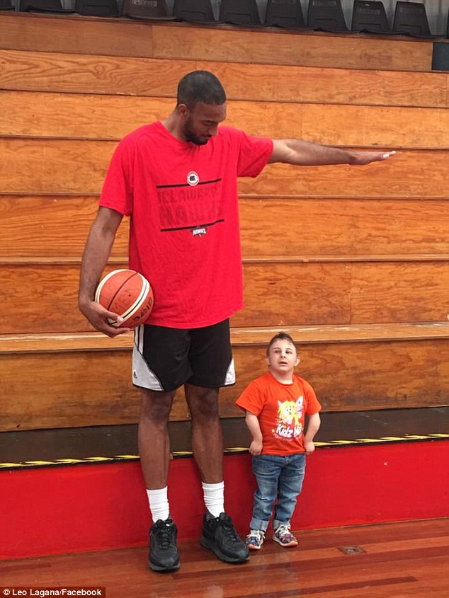 He had a rare form of primordial dwarfism (pictured with American basketball player Michael Holyfield, who is 7-foot-11)