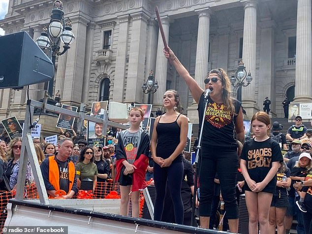 Lidia Thorpe brandished a 'battle stick' as she addressed a crowd on the steps of Victoria's Parliament.