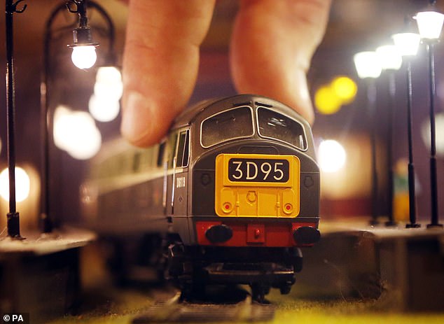 Off the rails: Model train company Hornby, which also makes Scalextric cars and Airfix model airplanes, plunged 13.8% on news it would make a 'modest' loss for the year to March