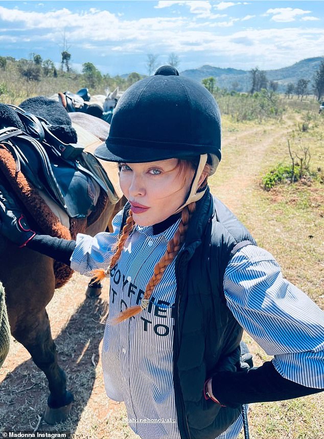 Back in the saddle: Madonna, 64, shared a video of herself riding a horse, apparently with some of her six children, while on vacation with her family in Kenya, an East African nation