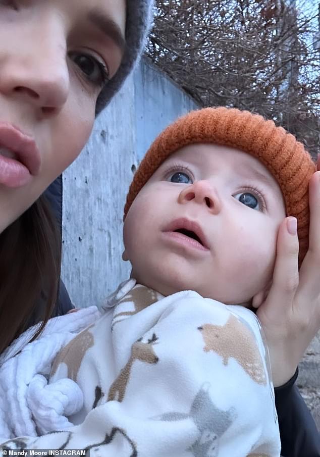 'Sweet little dreamer': Mandy Moore, 38, shared photos of her two children while filming on set on Monday and wrote the caption over the photo with Ozzie