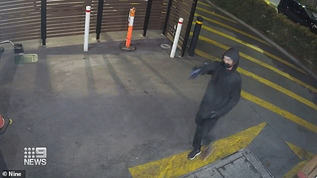 The first incident at Hungry Jack's in Springfield on Sunday night was captured on CCTV and shows a man brandishing a firearm as he enters the store through the rear entrance.