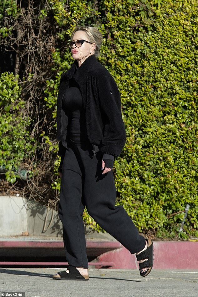 Sunshine: Melanie Griffith stepped out for a low-key stroll in sunny Beverly Hills on Friday, days after she was photographed with a large scar on her face.