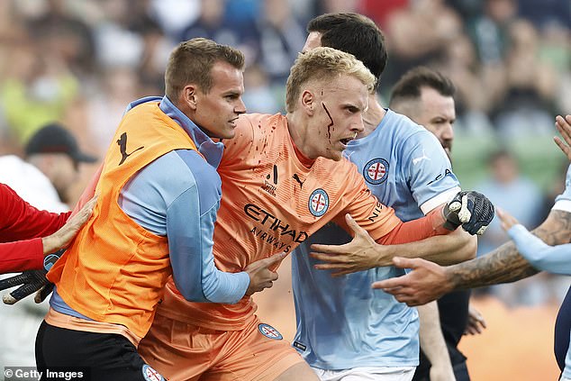 A-League officials are on edge after Victory's rebel supporter group 'Original Style Melbourne' confirmed they will attend the 'Big Blue' game against Sydney FC at AAMI Park (Pictured Tom Glover injured after the invasion of the field on December 17)