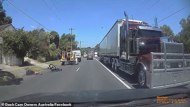 The footage captured the terrifying moment a cyclist was knocked off his bike by a truck before the vehicle continued to drive away.