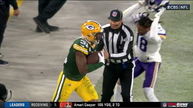 Justin Jefferson (right) appears to hit a band officer with his helmet in the first half