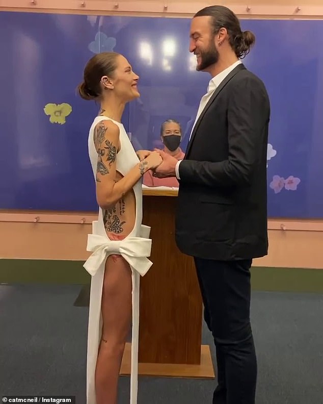 Cat made a statement as she tied the knot with American basketball player Miles Plumlee (right) in a New York courthouse on 23 February