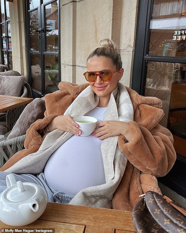 Cozy!  Molly-Mae Hague has enjoyed a cozy day enjoying a cup of tea as she bundled up in a fluffy brown jacket and stylish sunglasses.