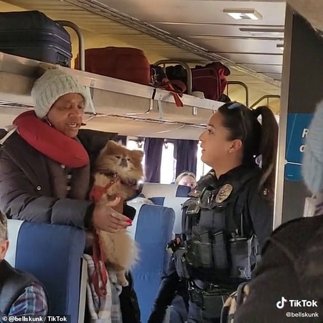 One of the sisters, whose name was not released, is seen here talking to an officer, before being escorted off the Amtrak train in Grand Junction, Colorado.