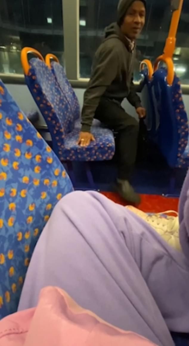 A woman was filmed kicking a strange man who pounced on her on a bus