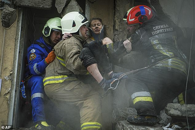 Katya is rescued from the rubble in a photo released by the State Emergency Service of Ukraine.