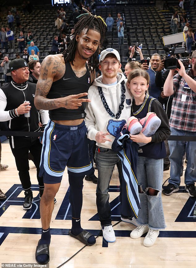 Memphis Grizzlies star Ja Morant added to his highlight video Wednesday by giving a young fan courtside seats, an autographed jersey and his sneakers after his team's signed ball was stolen at a I play earlier in the week.  Ellie Hughes, an 11-year-old Grizzlies fan, is seen with her and Morant's father after Wednesday's win.