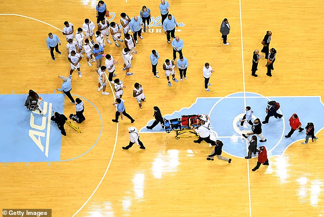 North Carolina state guard Terquavion Smith was stretchered off the field after a terrifying fall