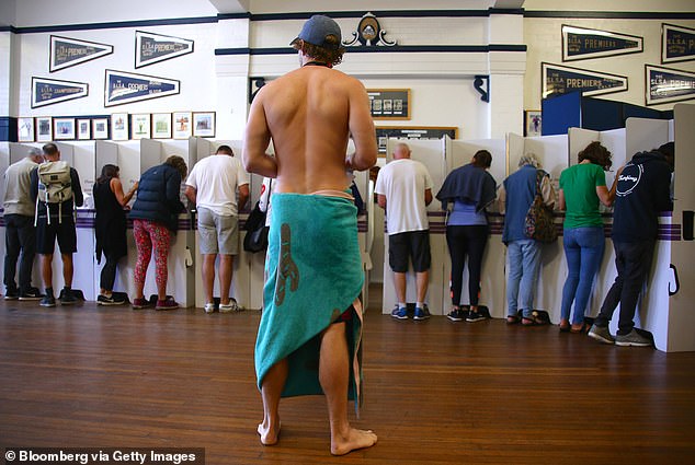 A new survey shows that young voters are turning to Labor to solve the cost of living crisis in NSW (pictured voting in the 2019 federal election)