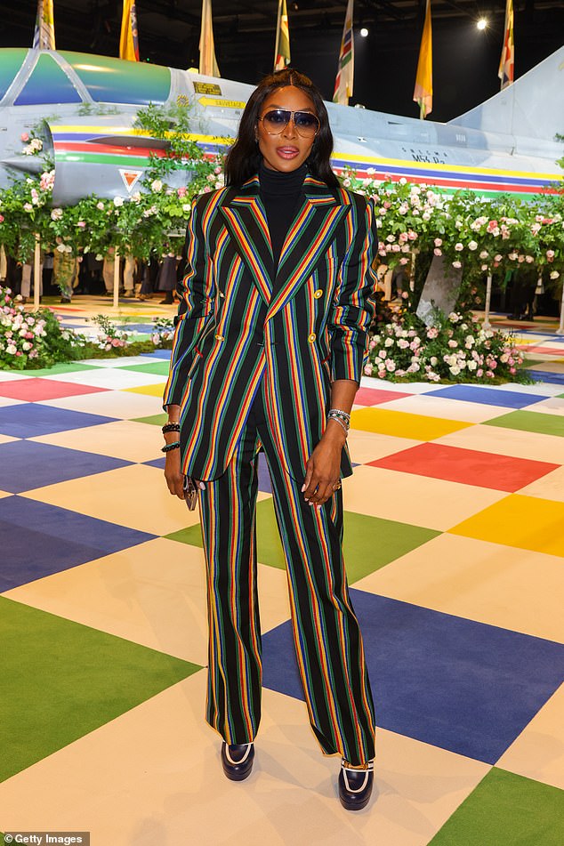 Off-duty supermodel: Naomi Campbell exuded effortless elegance at Paris Fashion Week in an oversized pinstripe pantsuit