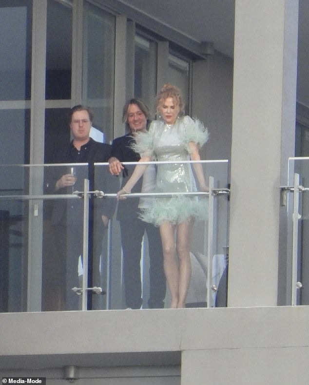 Nicole Kidman dazzled in a sparkly mini dress while hosting a star-studded New Year's Eve party with husband Keith Urban at their multi-million dollar North Sydney penthouse.