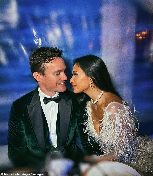 Smitten: Nicole Scherzinger and her fiancé Thom Evans looked more loved than ever as they ring in the New Year together on Saturday