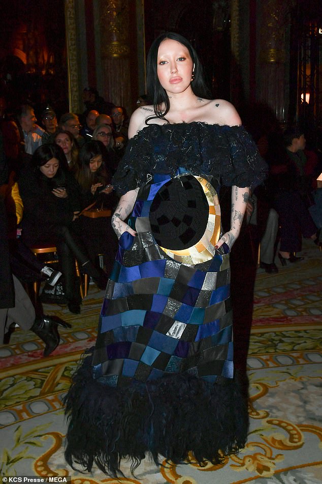 Style: Noah Cyrus got a little more covered up on Wednesday, slipping into a quirky illusion gown at the Viktor & Rolf Haute Couture Spring Summer 2023 show in the middle of Paris Fashion Week