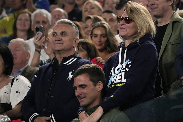 The parents of Serbia's Novak Djokovic, father Srdjan and mother Dijana react during his post-match speech following his win over Russia's Andrey Rublev.