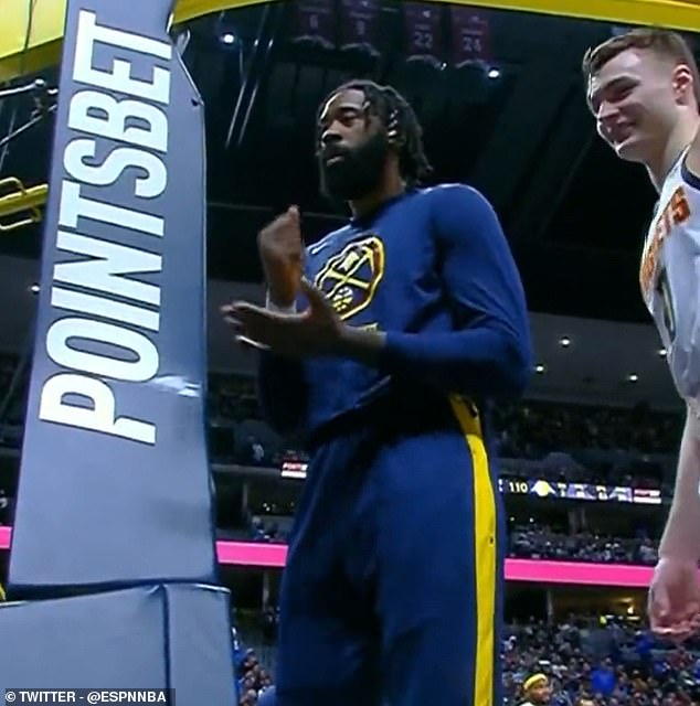 Nuggets center DeAndre Jordan played rock-paper-scissors with a fan during a delay in the game