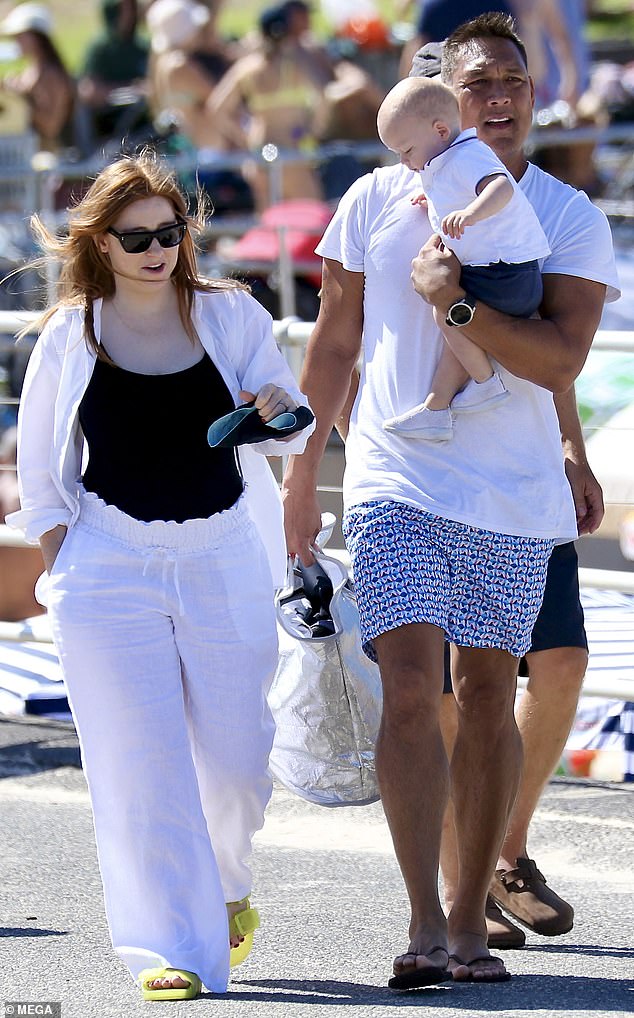 Olympic swimmer Geoff Huegill was every inch the doting dad on Sunday as he enjoyed bonding with his partner Roxy and their one-year-old son Rafe on Bondi Beach.