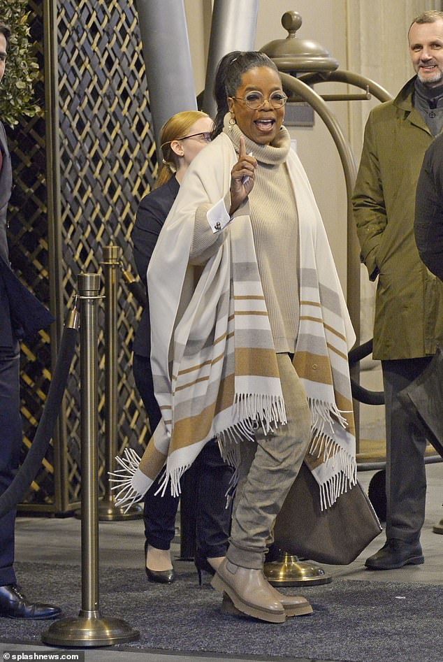 Goodbye Big Apple!  Self-made mogul Oprah Winfrey donned a luxurious striped cashmere blanket as she left the Four Seasons Hotel New York Downtown on Thursday after enjoying her first trip to Manhattan in three years.