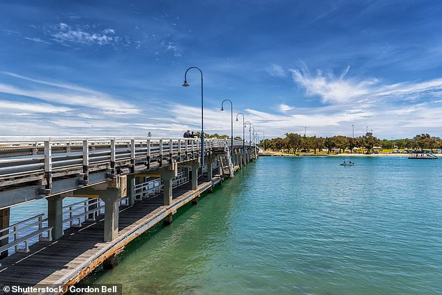 The boat carrying people hit a red pole near the Mandurah Bridge (pictured)