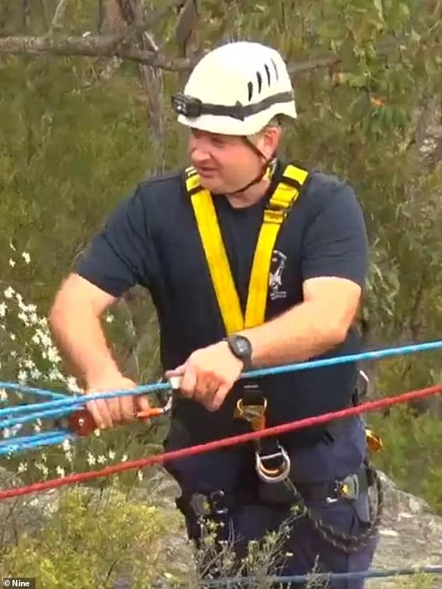 Police rescue officer Peter Stone (pictured) drowned on New Year's Day after diving into rough water off Bogola beach to save his 14-year-old son.