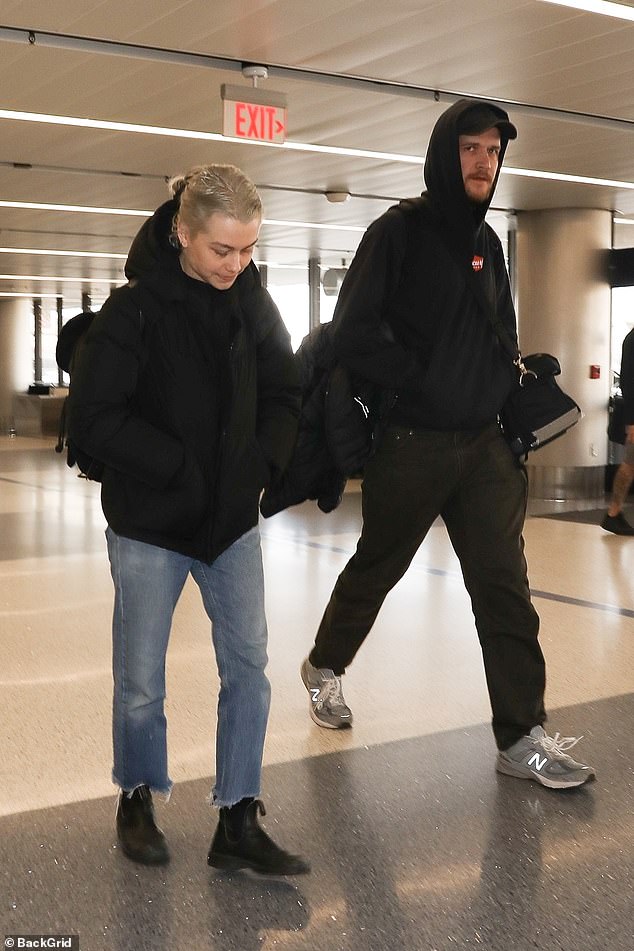 By her side: Phoebe Bridgers was supported by her rumored new boyfriend Bo Burnham as she headed to the airport on Friday, a week after announcing her father's death.