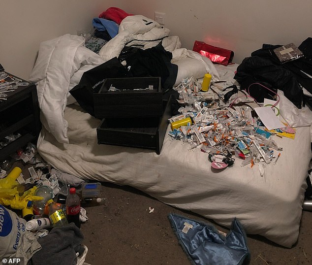 A 36-year-old man and a 43-year-old woman were arrested for allegedly selling drugs in Hawker, northwest of Canberra.  Police raided a home in suburban Cook and found piles of syringes, drugs, $20,000 in cash and dangerous chemicals used to make illicit substances (pictured)