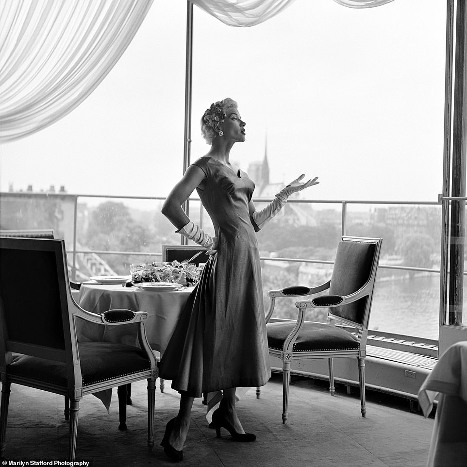 Model in Tour D¿Argent by Marilyn Stafford: The photographer captured this image in Paris, circa 1955. The model is seen wearing a Givenchy Haute Couture gown.