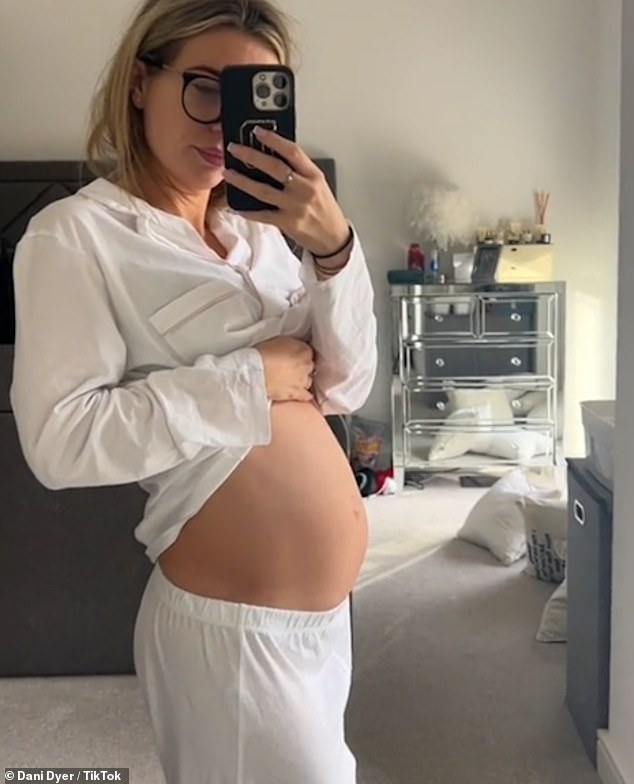 Waiting: Dani Dyer, 26, showed off her growing bump in a heartwarming video montage from her pregnancy journey on Friday