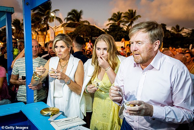 Catharina-Amalia (pictured, center) cut a graceful figure as she joined her parents Queen Máxima and King Willem-Alexander at the Taste of Bonaire festival during their two-week visit to various countries and municipalities in the Kingdom from the Netherlands.