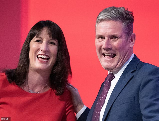 Happy days: Shadow Chancellor Rachel Reeves and her boss Sir Keir Starmer join company leaders