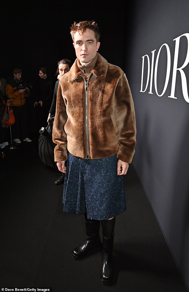 Stylish: Robert Pattinson, 36, made a grand entrance when he arrived at the Dior Homme show during Paris Fashion Week on Friday