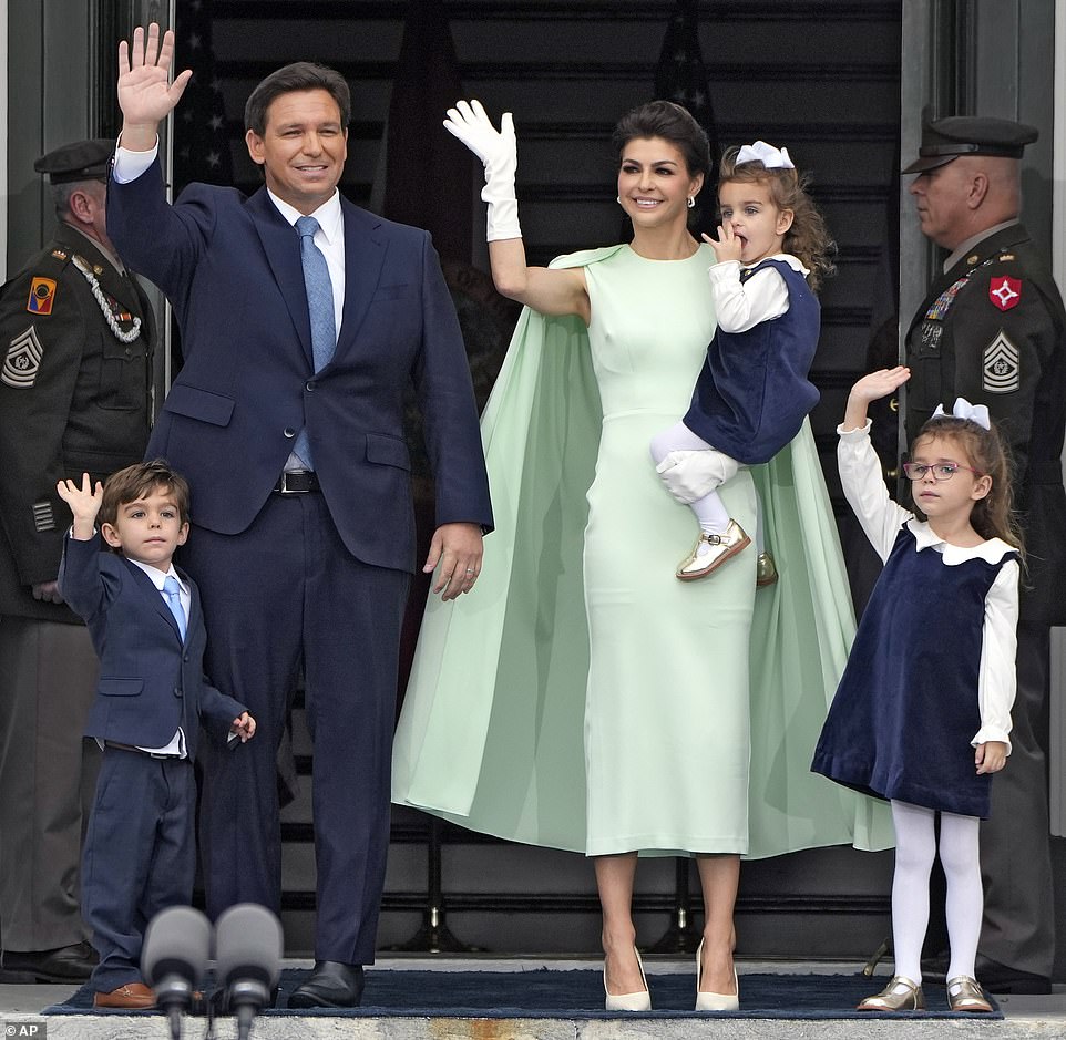 Casey DeSantis has stunned in a green cape dress at her husband Ron's inauguration as he was sworn in as Governor of Florida for a second term.