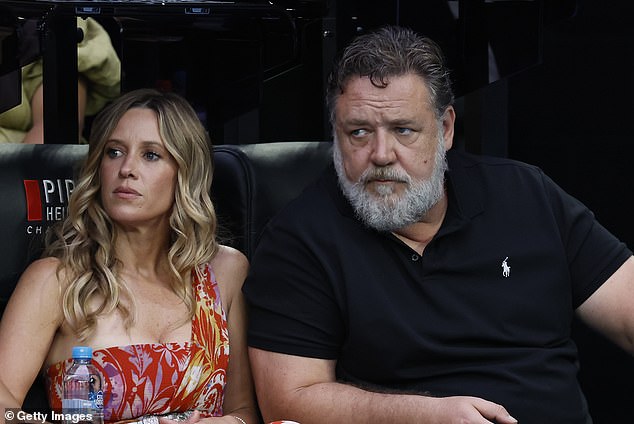 Russell Crowe took a well-deserved break while relaxing with girlfriend Britney Theriot at the Australian Open in Melbourne on Saturday.  both in the photo