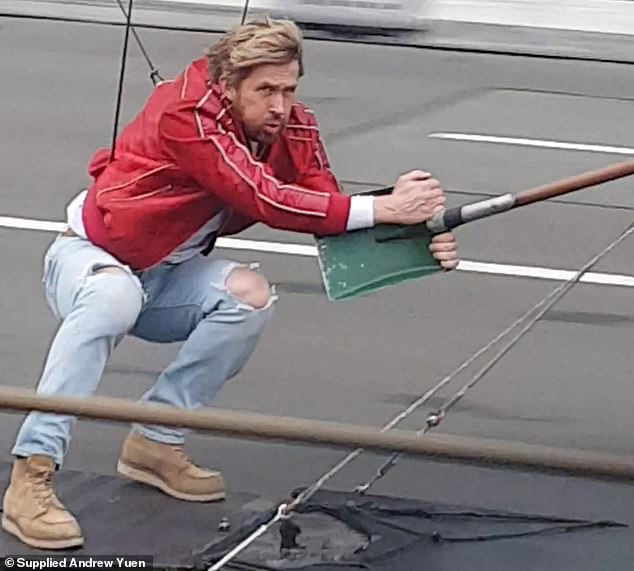 Ryan Gosling looked every inch the action star on Sunday as he pulled off his own stunts while filming his new movie The Fall Guy on the Sydney Harbor Bridge.