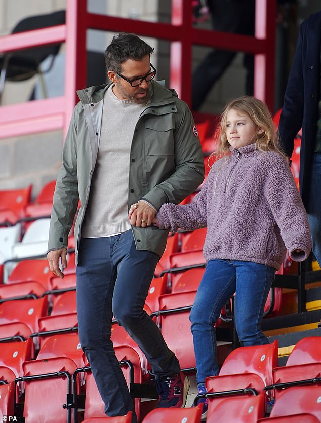 Out and about: Ryan Reynolds enjoyed some quality time with his daughter James on Sunday when they attended Wrexham's FA Cup game against Sheffield United
