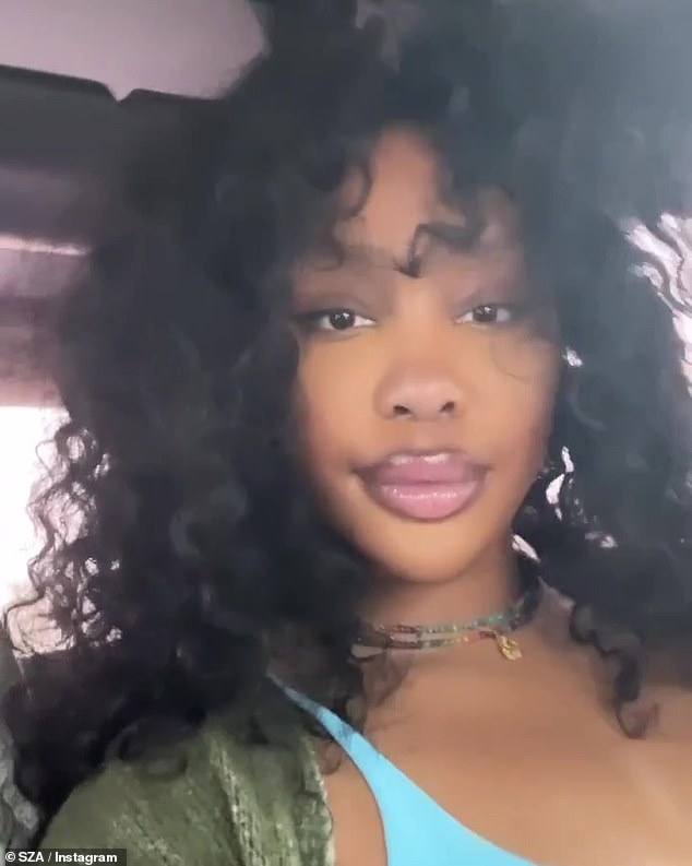 Above: SZA took to Instagram Tuesday to celebrate her new album SOS reaching number one on the Billboard 200 chart for the third week in a row.