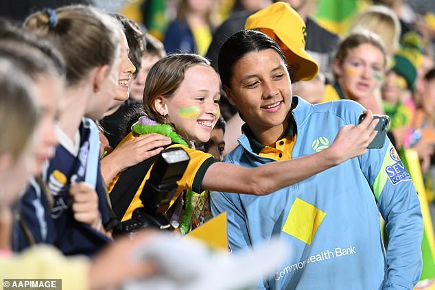Kerr signs autographs for fans after the women's international football match between Australia and Thailand at the Central Coast Stadium in Gosford