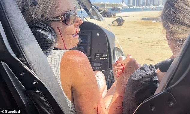 Pictured: Elmarie Steenberg and Marle Swart sit inside a helicopter after it collided with another on January 2.