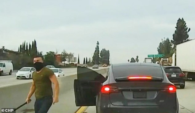 The footage shows Radimak jumping out of his black Tesla Model X and approaching several other vehicles with a metal tube which he proceeds to use to beat the cars, before getting back into his car and shooting off.