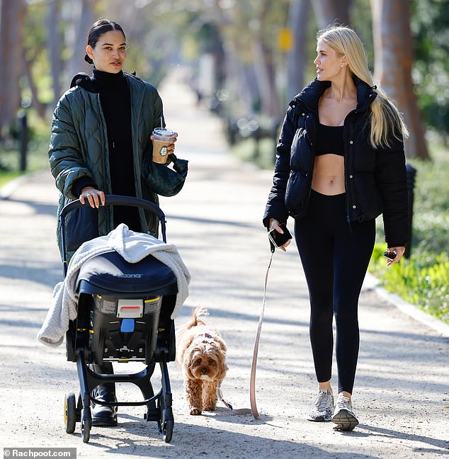 Casual outing: Shanina Shaik, 31, was out for a walk with her four-month-old baby and her friend Georgia Sinclair in Los Angeles on Friday