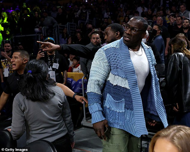 FS1 host and former NFL player Shannon Sharpe had to be restrained by security at Friday's Lakers-Grizzlies game in Los Angeles after a verbal confrontation with the Memphis players at halftime.