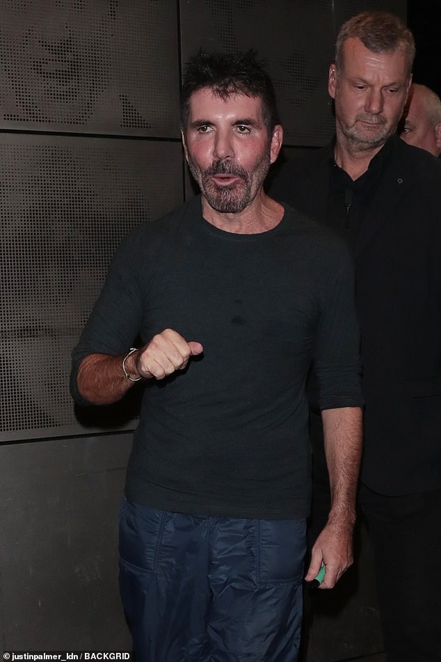 Emerging: Simon Cowell cut a casual figure after a day of auditions for Britain's Got Talent on Sunday night