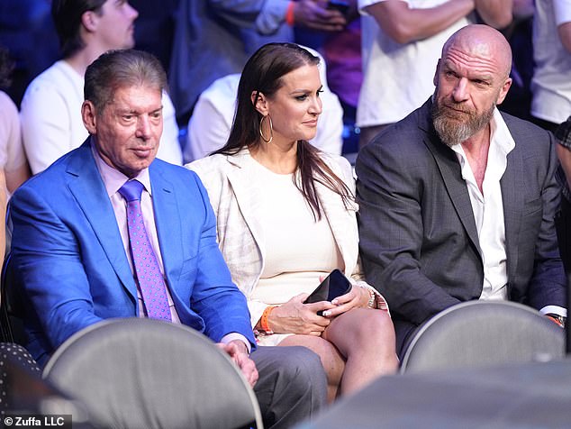 Stephanie McMahon (C) has stepped down as WWE CEO after her father, Vince (L), returned to the wrestling franchise and the board of directors was reappointed.