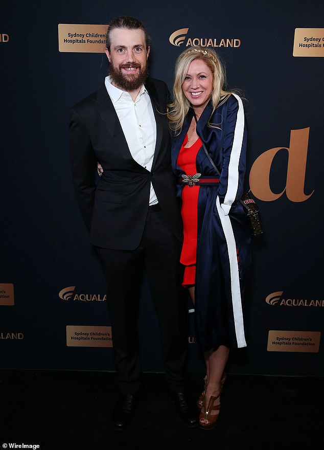 The $30 billion project to harvest solar power in the Australian outback and send it to Singapore is in jeopardy after a disagreement between its billionaire investors, Mike Cannon-Brookes (pictured left, with his wife Annie) and Andrew Forrest.