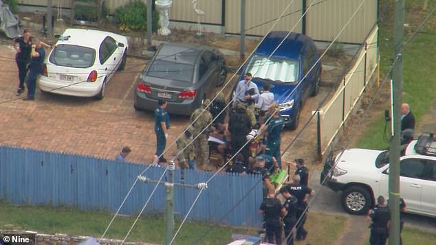 A 26-year-old woman was taken to hospital for observation after she was allegedly held captive by a 25-year-old man at the Sunnybank Hills home (pictured)