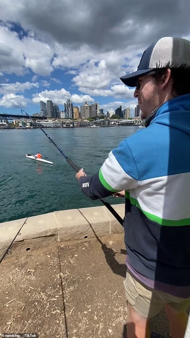 Adam Bailey, 30, and a friend were standing on the edge of the harbor with their fishing lines tossed into the water.